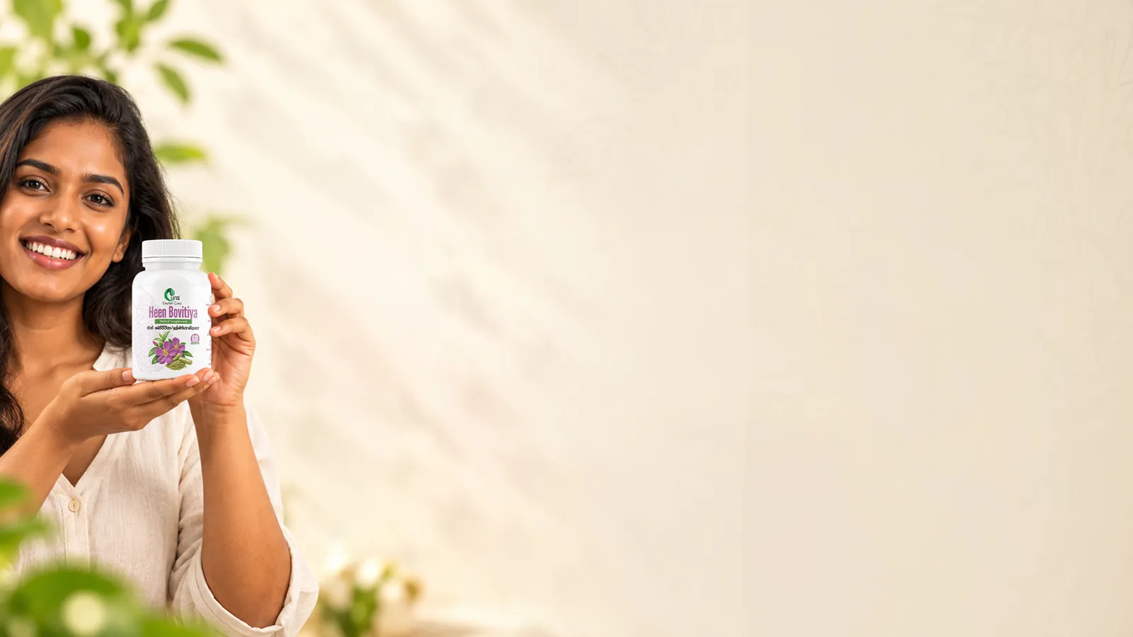 A woman holding a bottle of Ceylon Cura Heen Bovitiya capsules